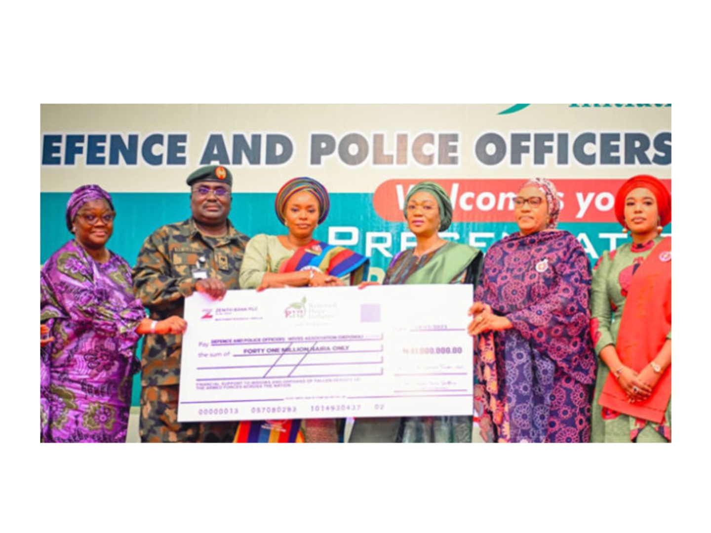 First Lady presents cheques to wives of fallen heroes